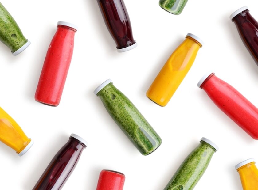 Colorful smoothies in glass bottles
